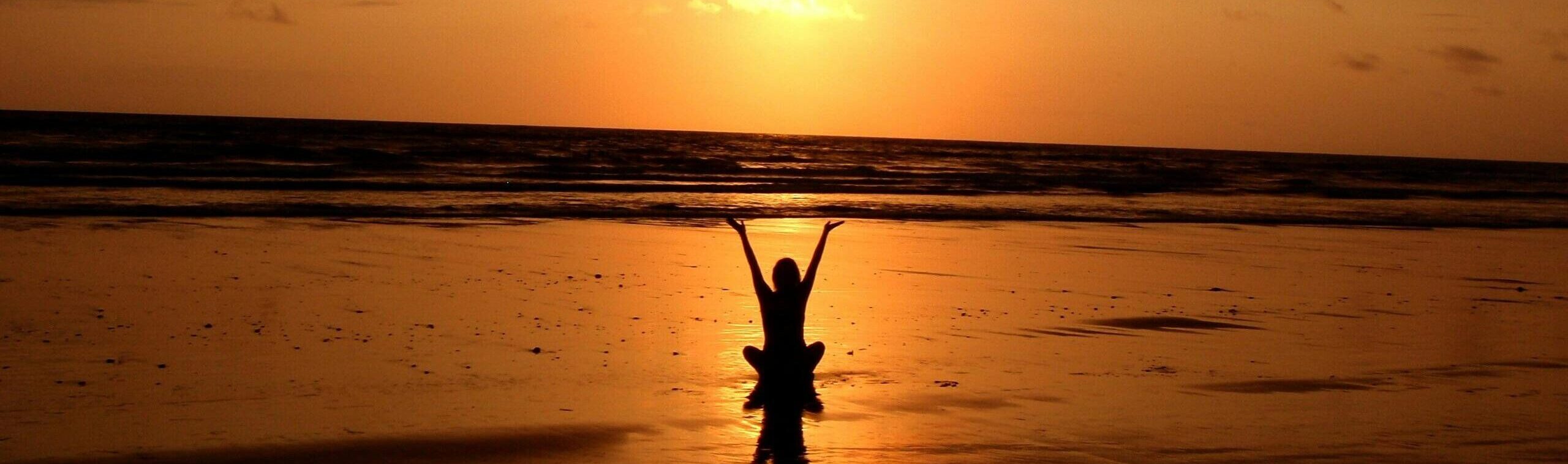 12. Person in water at sunset